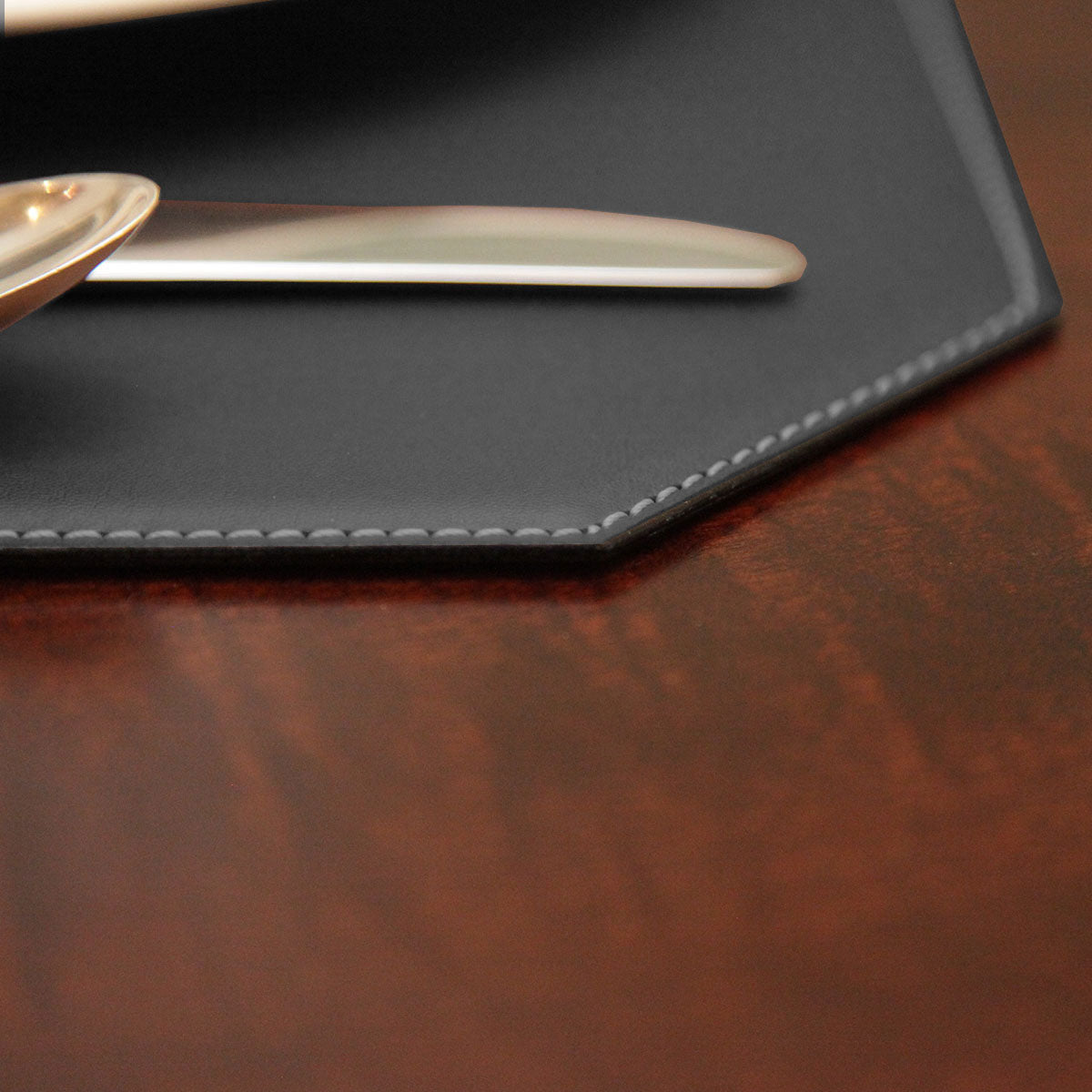 Black 17" x 12" Leatherette Cut Corner Placemat w/ White Stitching