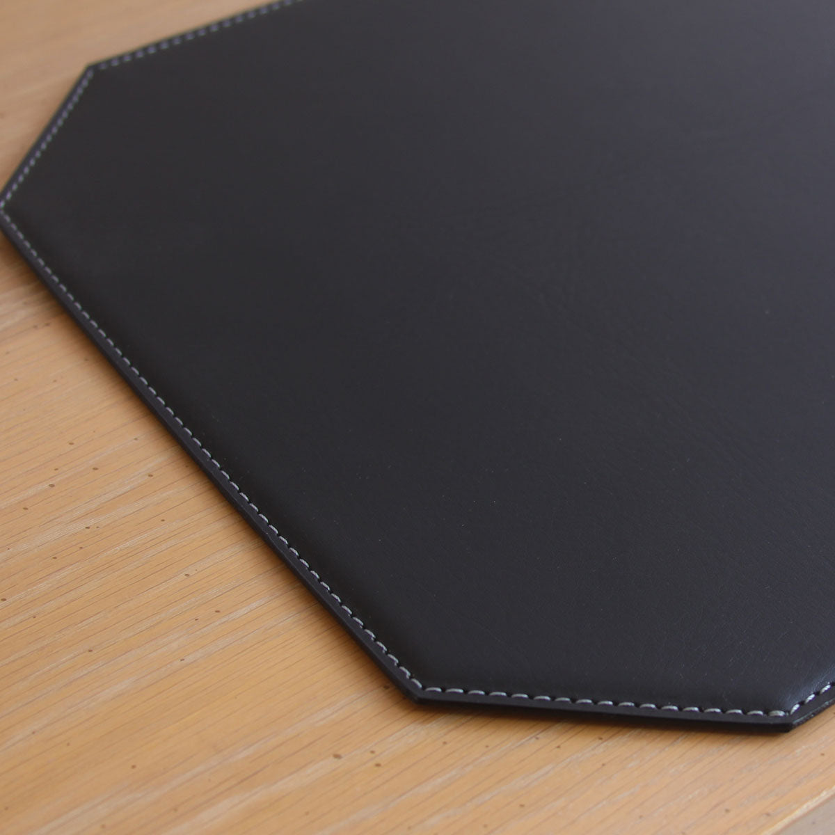 Black 17" x 12" Leatherette Cut Corner Placemat w/ White Stitching