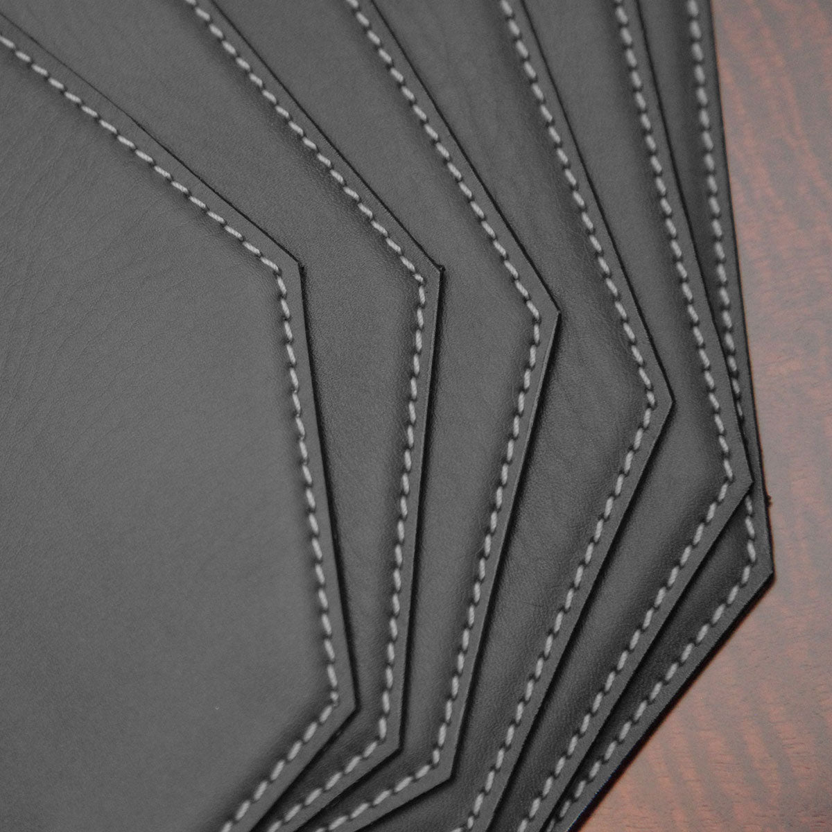 Black 17" x 12" Leatherette Cut Corner Placemat w/ White Stitching
